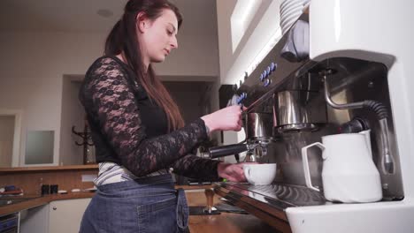 Girl-making-coffee-with-lever-maker,-using-steam-to-froth-milk-cream,-wide-angle-closeup