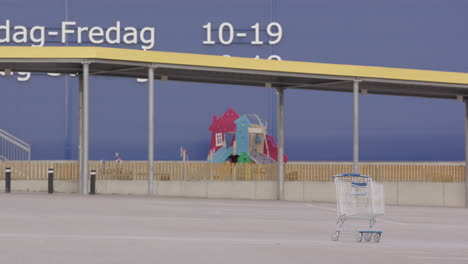 An-abandoned-trolley-stands-in-an-empty-IKEA-car-park-in-Sweden