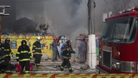 First-responders-work-together-to-battle-fierce-blaze-in-Sao-Paulo,-on-Tereza-Cristina-avenue,-Ipiranga-district