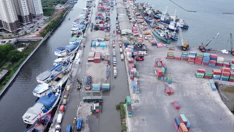 aerial-shot-of-pier-atmosphere-with-container-loading-and-unloading-ships