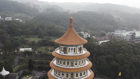 Circular-motion-of-the-top-part-view-of-the-temple---Experiencing-the-Taiwanese-culture-of-the-spectacular-five-stories-pagaoda-tiered-tower-Tiantan-at-Wuji-Tianyuan-Temple-at-Tamsui-District-Taiwan