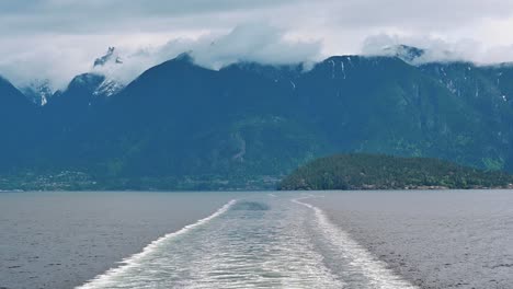 Shot-of-Bowyer-Island-in-British-Columbia-with-clouds-over-mountains