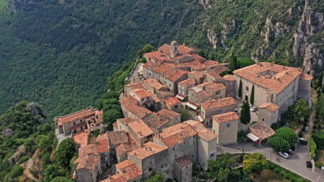 Gourdon-France-Aerial-v2-birdseye-view-drone-hovering-around-high-altitude-mountain-clifftop-old-defensive-stone-castle-ruins-and-village---July-2021