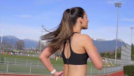 Attractive-athletic-young-woman-running-outdoors-Slow-motion