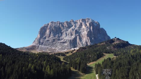 Aerial-view-of-Sassolungo,-a-big-mountain-in-Val-gardena-valley-in-South-Tirol-in-Italian-Alps