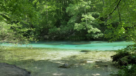 A-beautiful-river-at-Bohinj,-Slovenia-with-clear-and-colorful-water