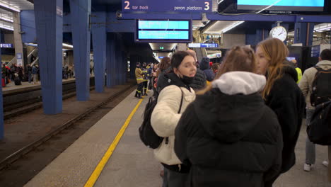 2022-Russian-invasion-of-Ukraine---Central-Railway-Station-in-Warsaw-during-the-refugee-crisis---people-waiting-on-the-platform-for-the-train-to-Vienna