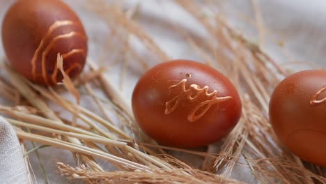 Easter-Eggs-Decorated-with-Natural-Fresh-Leaves-and-Boiled-in-Onions-Peels,-top-view
