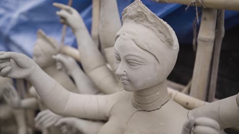 Sculpture-or-idol-of-Indian-goddess-Durga-about-to-be-completed,-slow-motion-shot