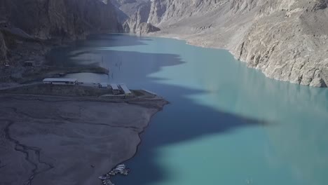 Drone-shot-over-Attabad-lake,-revealing-mountain-view,-Hunza-Valley,-Pakistan-Aerial-View-Of-Attabad-Lake-Next-To-Karakoram-Highway,-Hunza-Valley-In-Gilgit−Baltistan,-Pakistan---drone-shot