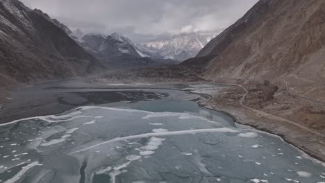 Aerial-view,-flying-directly-on-a-drone-over-the-frozen-Lake