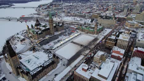 Drone-shot-of-Freedom-Trucker-Rally-on-Slater-Street-in-Ottawa,-ON-on-January-30,-2022-during-the-COVID-19-pandemic