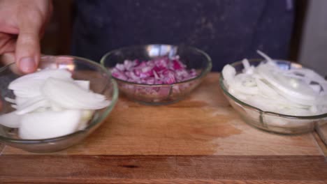 Person-showing-different-types-of-onion-cuts,-slices,-dice,-brunoise