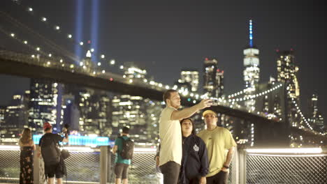 People-Take-Selfie-In-Front-Of-September-11th-Memorial-Lights-In-New-York-City