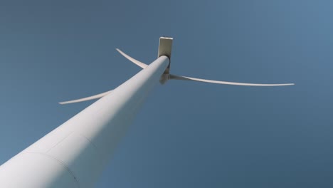 A-wind-turbine-spins-on-a-sunny-day
