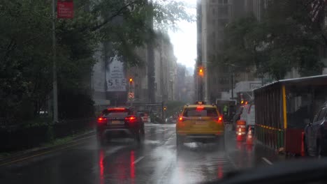 POV-driving-in-rainy-New-York-City-behind-a-yellow-taxi