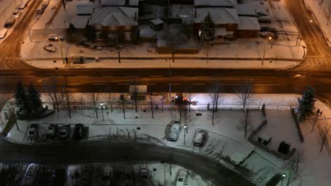 Top-night-view-of-frozen-downtown-residential-area-after-heavy-snowfall-with-street