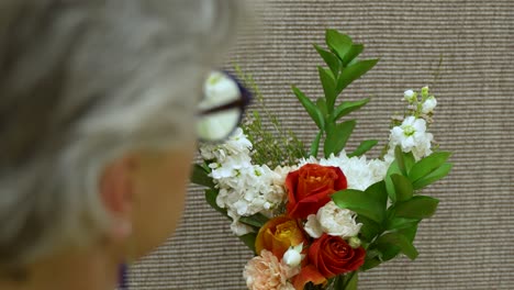 A-florist-makes-the-final-adjustments-on-a-bouquet-of-flowers