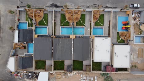 Luxury-real-estate-housing-for-hosts-and-travelers,-drone-overhead-ascending-shot