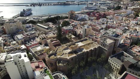 Topdown-view-of-Cathedral-of-the-Incarnation-of-Almería-revealing-Waterfront-Downtown,-Spain