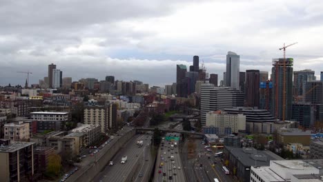 Aerial-view-flying-away-from-Seattle's-downtown-skyscrapers-to-reveal-how-much-traffic-there-is-in-the-city,-circa-2016