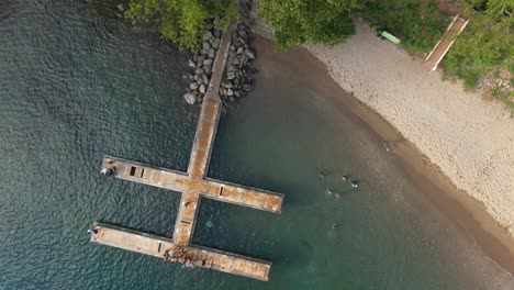 Local-dock-and-beach-Top-down-drone-video