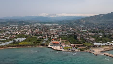 Coming-Into-Shot-Of-Beautiful-Koura-City-Waterfront-From-Sky,-Lebanon