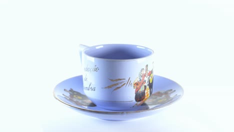 Ancient-Unique-And-Rare-Blue-Teacup-And-Saucer-Portuguese-Musical-Fado-From-Coimbra-Themed-Souvenir---360-Rotating-4K