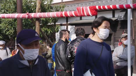 Japanese-people-wearing-masks-at-festival-during-Spring