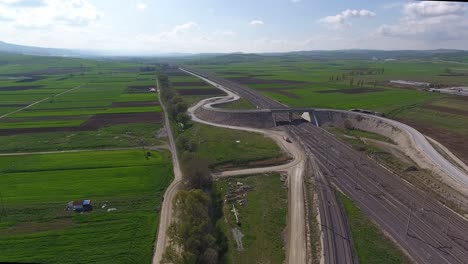 Train-Station,-Train-and-Bridge-in-Drone-Video