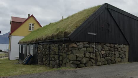Medium-Close-Up-of-a-Sod-Roof-Home-in-Gjogv,-Faroe-Islands
