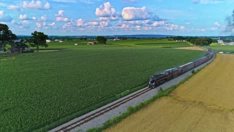 An-Aerial-Following-View-of-an-Antique-Steam-Passenger-Train-Blowing-Smoke-Thru-Pennsylvania-Farm-Lands