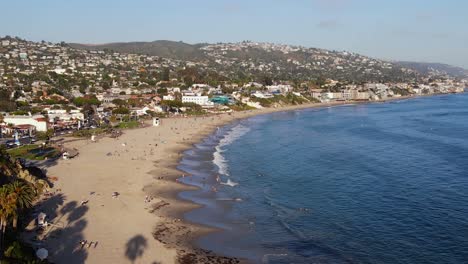 Aerial-view-overlooking-the-Laguna-beach,-on-a-calm,-sunny-day-in-Orange-county,-California,-USA