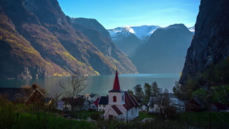 Fast-moving-shot-of-Flam,-village-with-a-church-in-Flamsdalen,-at-the-Aurlandsfjord-a-branch-of-Sognefjord-which-is-municipality-of-Aurland-in-Norway