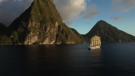 Saint-Lucia's-beautiful-coast,-with-the-Royal-Clipper-cruise-ship-passing-by