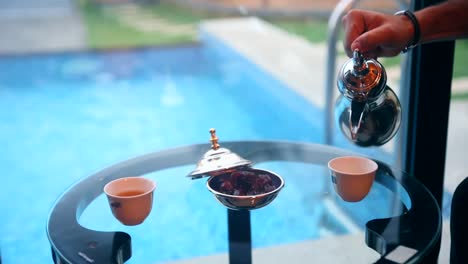 Arabic-hospitality-concept,-tea-pot-with-refreshments-oriental-traditional-scene
