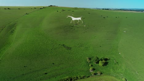Alton-Barnes-scoured-white-horse-chalk-art-countryside-aerial-view-towards-farmland-landmark