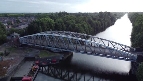 Aerial-view-Manchester-ship-canal-swing-bridge-reflections-traffic-Warrington-England