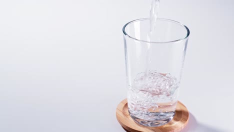 Pure-Water-Poured-Into-Glass-Closeup-with-Slow-motion