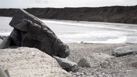 Medium-Wide-shot-of-rocky-beach-and-its-hills-in-England-near-Hornsea