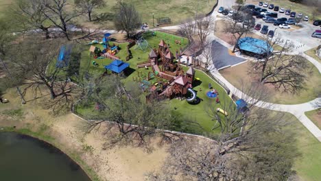 Aerial-footage-of-Kid's-Kastle-playground-in-Unity-Park-in-highland-Village-Texas