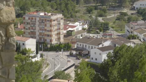 Cars-drive-around-a-tight-corner-in-the-small-Spanish-village-of-Chulilla
