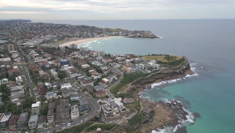 Aerial-drone-view-of-Sydney-Coastline-featuring-Malabar,-Tamarama,-Bondi-Beach-and-ocean-horizon