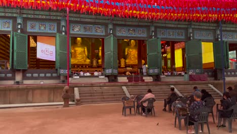 Wide-shot-of-south-korean-people-praying-in-front-of-buddha-temple-ceremony-in-Seoul,Jogyesa