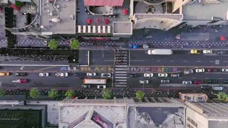 All-Black-Lives-Matter,-Aerial-Drone-Shot-above-Hollywood-Boulevard-featuring-Human-Rights-Art