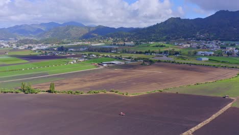 Drone-flyover-above-cultivated-fields-in-Constanza-landscape,-Dominican-Republic