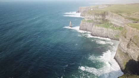 Drone-scenic-view-of-Cliffs-of-Moher-during-a-sunrise-next-to-the-atlantic-ocean,-Ireland