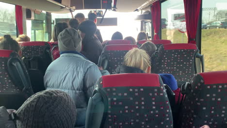 Ukrainian-refugees-on-a-bus-traveling-to-Poland-to-escape-the-war-with-russia
