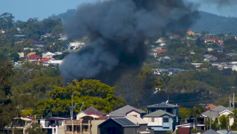 Billowing-thick-black-smoke-and-large-lapping-flames-can-be-seen-from-miles-away-from-a-terrifying-suburban-fire