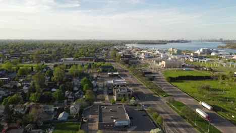 Wyandotte-township-with-skyline-of-Detroit-in-horizon,-aerial-drone-view